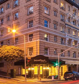 The outside of WorldMark San Francisco resort lit up at night.