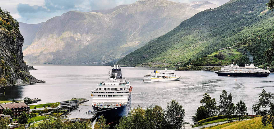 Cruise ships sailing through a bay in Alaska.